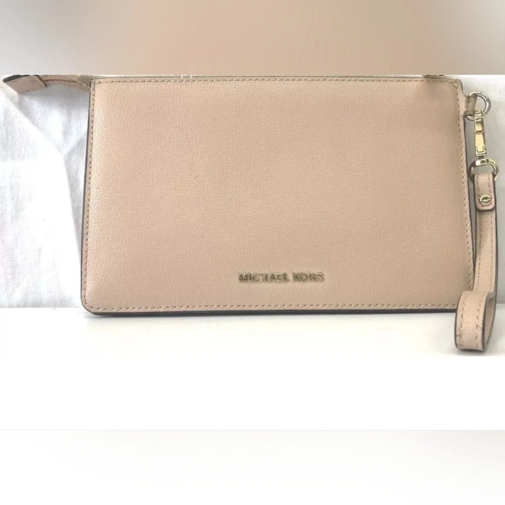 Michael Kors tan wristlet.